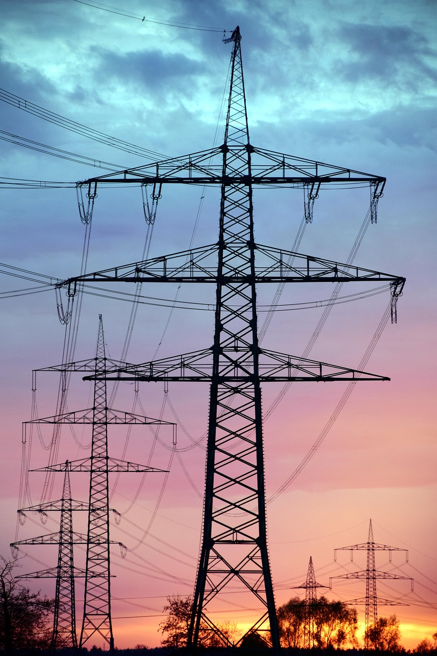 High-voltage transmission pylon at dusk